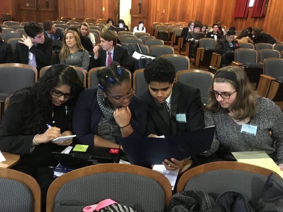 %E2%80%8BCanton+High+School+Juniors%2C+Shian+Earlington+as+Panama+and+Heather+Murphy+as+the+United+States+of+America+seen+discussing+their+topics+in+their+General+Assembly+committees+unmoderated+caucus.+They+are+accompanied+by+fellow+committee+peers+representing+Ethiopia+and+Pakistan.+-+photograph+by+Shian+Earlington++