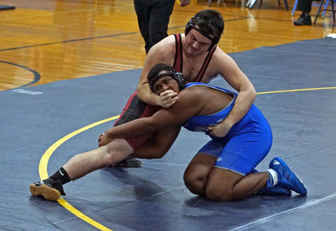 Fluckiger looking to wrap up and pin an opponent in a junior year match. Photo courtesy of Braydon Fluckiger and the Fluckiger family. Used with permission.
