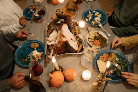 A Thanksgiving gathering, something that will look very different this year due to COVID holiday restrictions. cottonbro/Pexels