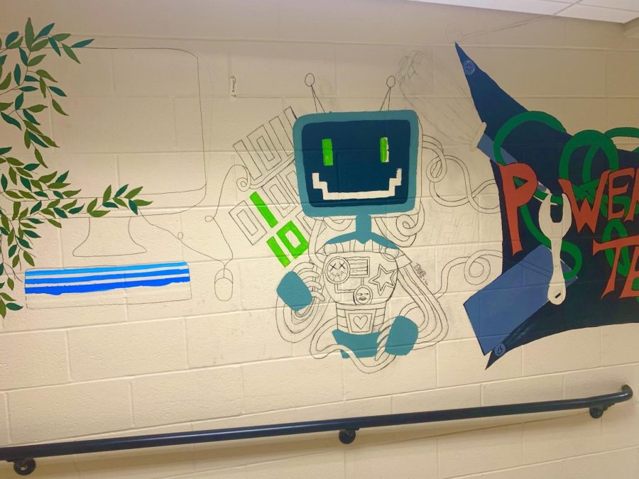 Students begin work on a mural connecting the technology wing to the arts wing. Gabbie Marcuccio/The Canton Journal