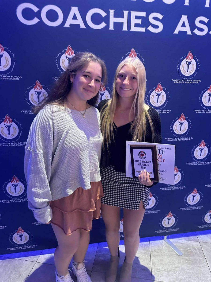 Madison Dufresne and Lyla O’Connor receiving their field hockey awards.